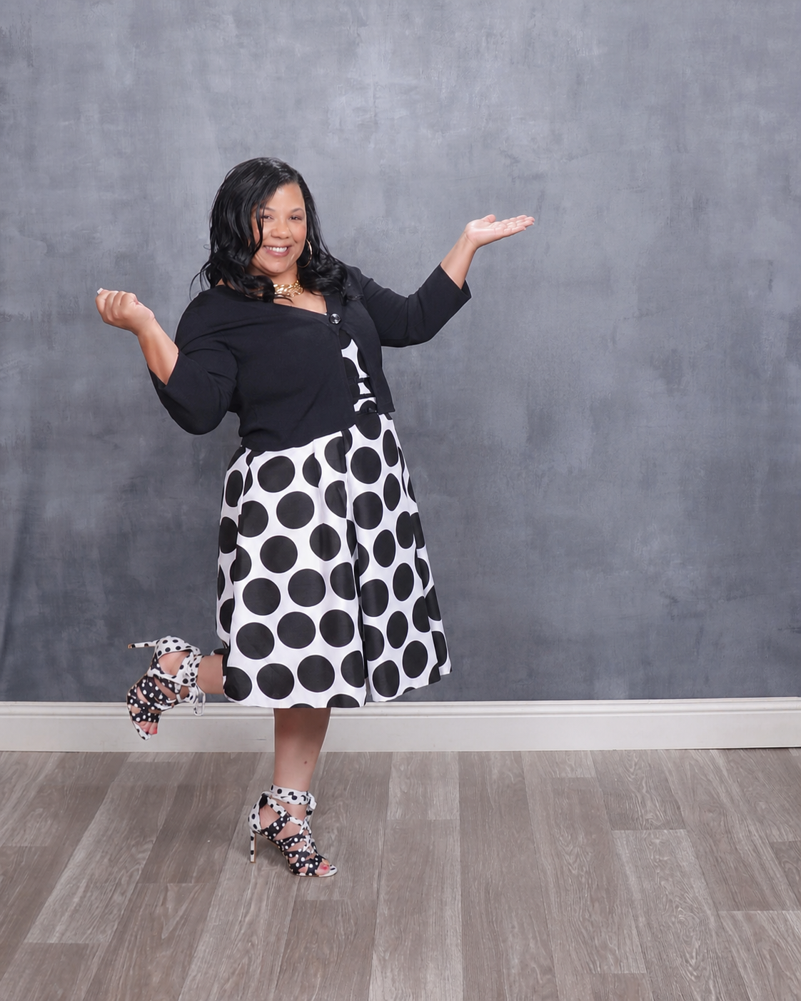 Pastor Barbara Tabb smiling in her signature black-and-white pose